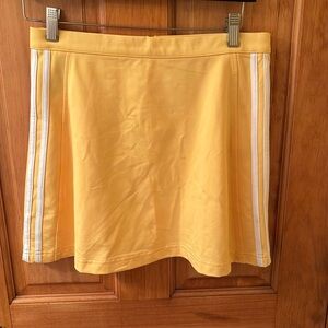 Bright yellow Adidas skort in size 10.